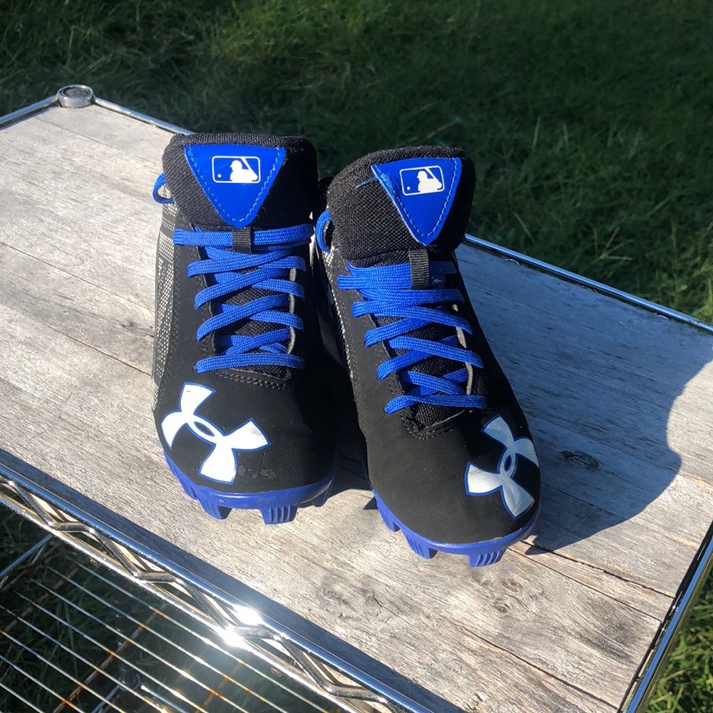 Under Armour baseball cleats, size 1 youth,Black , blue and white